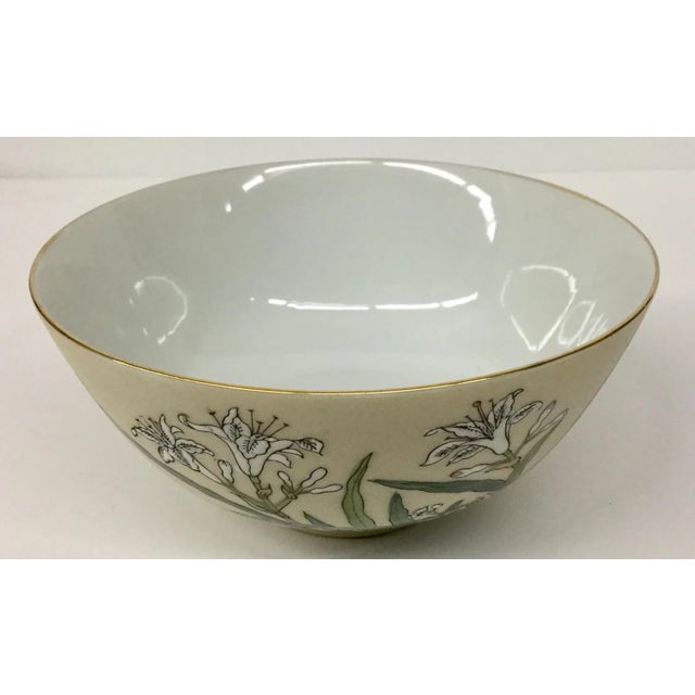 Pretty colors make this Bowl stand out among the rest. We love the green and white florals on the slightly celery colored...