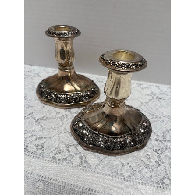Vintage pair of etched floral silver plated candleholders with engraved flowers and swirled patterns. Classic elegance for...