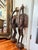 Monumental pair of hand-carved West African bird sculptures in the Senufo sejen hornbill tradition, each individually...