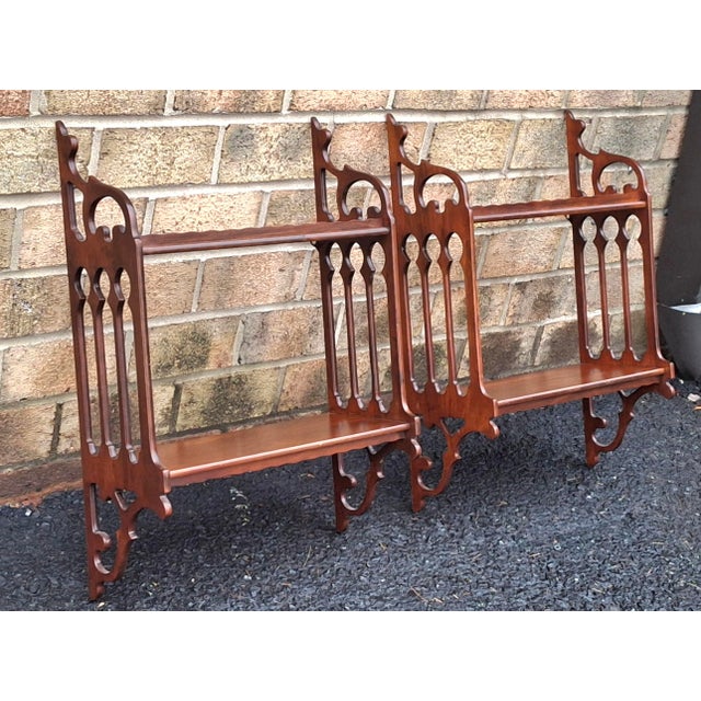 A Pair of Mid-Century Chinese Chippendale Style Mahogany Wall Shelves with pierced through fretwork. Measures: 17" W x...