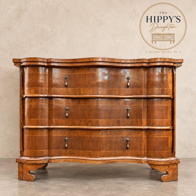A stunning, dramatic serpentine/bombe form, burl walnut chest with decorative banding, three large sculptural drawers,...