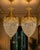 A refined pair of 1980 French Louis XVI–style bronze and crystal lantern chandeliers, made in Europe and finished in a...