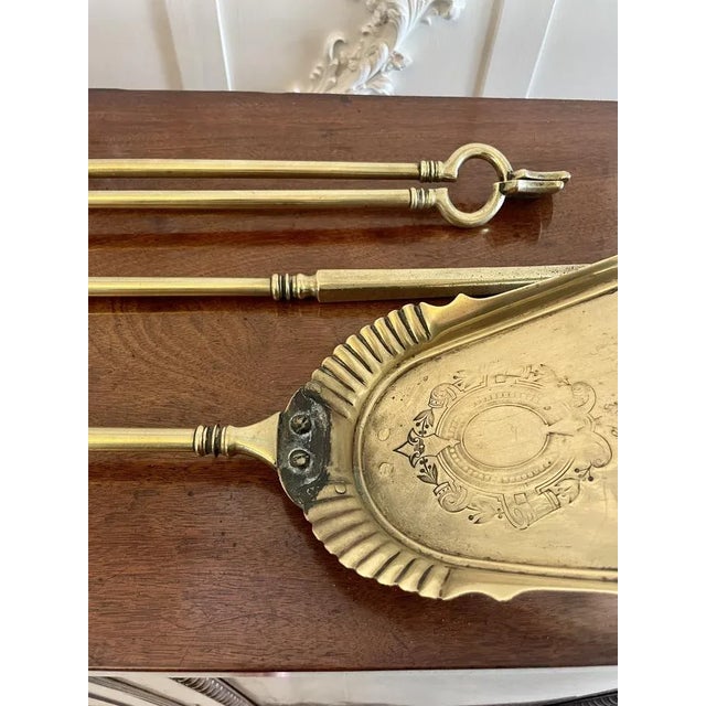 Set of antique george iii quality brass fire irons consisting of a shovel, poker and fire tongs with reeded and ornate...