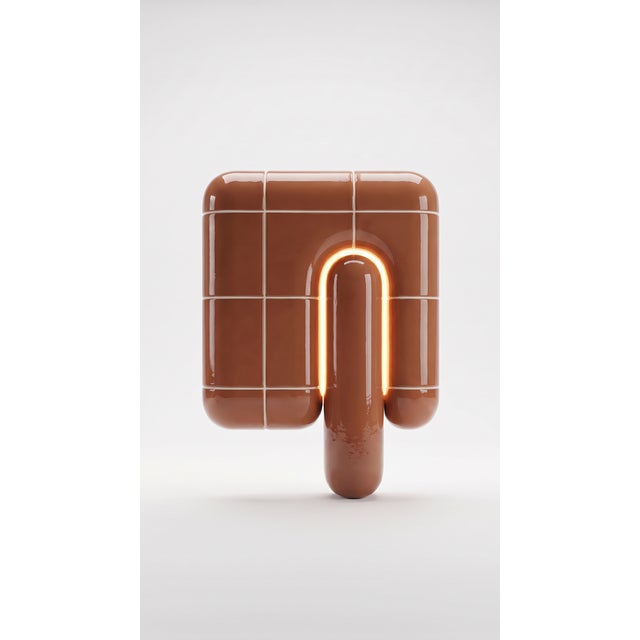 The smallest lamp in the collection, and often the first one people reach for. Its folded form hides the source entirely,...