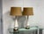 Design Plus Gallery presents a Pair of Vintage Mid 20th Century Ceramic Table Lamps. They both have antique bronze bases...