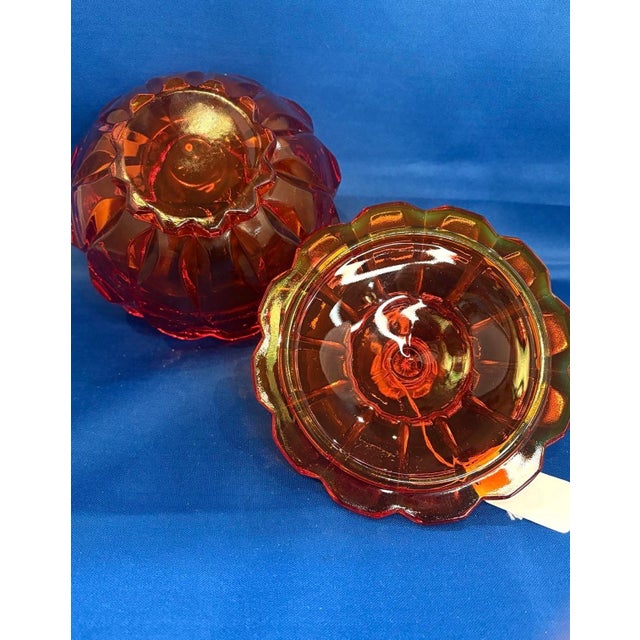 This is a vintage Fenton Valencia Amberina Persimmon Covered Candy Dish, crafted in striking orange-red art glass that...