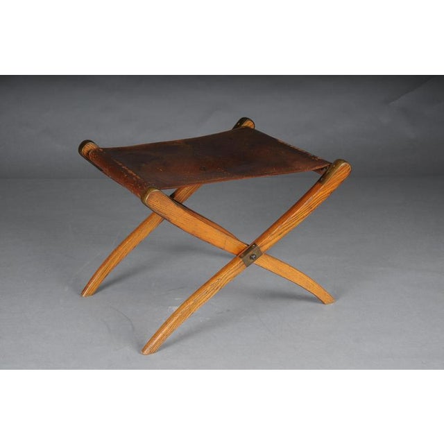 Antique Art Nouveau folding stool with leather, circa 1910 Solid wood stool, folding mechanism, leather covering partially...