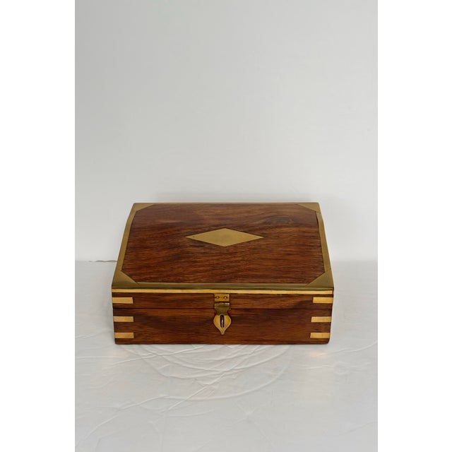 We are pleased to offer this refined vintage wooden box, circa mid-20th century, distinguished by its warm, richly grained...