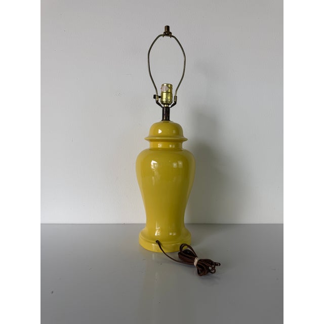 Striking 1970s Vintage Yellow Ginger Jar Ceramic Table Lamp featuring a bold glossy yellow glaze and elegant urn-form...