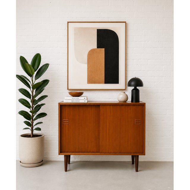 Danish Mid Century Modern Teak Jr. Credenza / Storage Cabinet, c. 1960's. This piece is highlighted by some incredible...