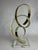 A modern sculpture by Dan Murphy. Of gold aluminum, the element reaches to the sky