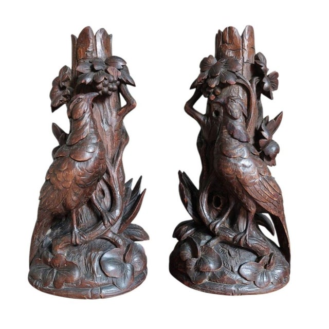 Set of two walnut wood vases with pheasant masterfully carved from the black forest region of Germany with floral and...