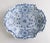 A beautiful rare 18th century four-lobed Delft dish, decorated in blue monochrome with flowers and semi-circles in...