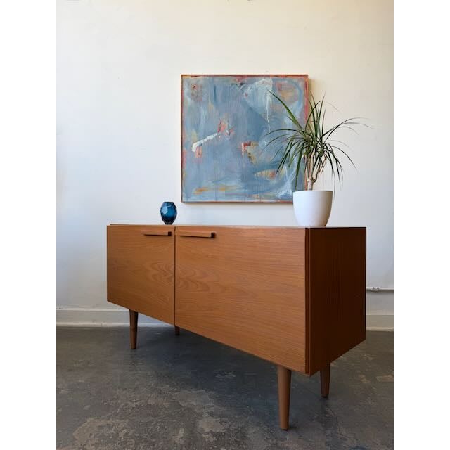 Need a solid place to hide your clutter/records/stuff?! This vintage mid-century teak compact credenza has been cleaned...