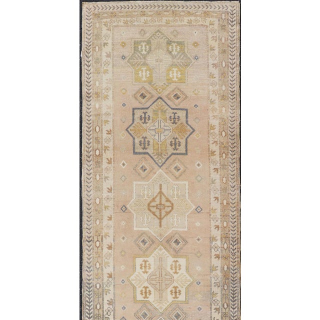 Measures: 3'1 x 11'7 Antique Turkish Oushak Runner with Soft Gold and Celadon Geometric Medallions. Keivan Woven Arts /...