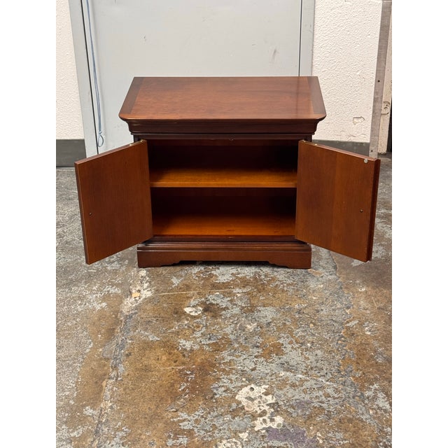 Design Plus Gallery presents a French Louis Philippe Cherry Wood Bedside Chest by Grange. Founded by Joseph Grange in 1904...