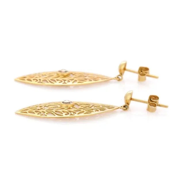 Diamond Dangle earrings to make a statement with your look. These earrings create a sparkling, luxurious look featuring...