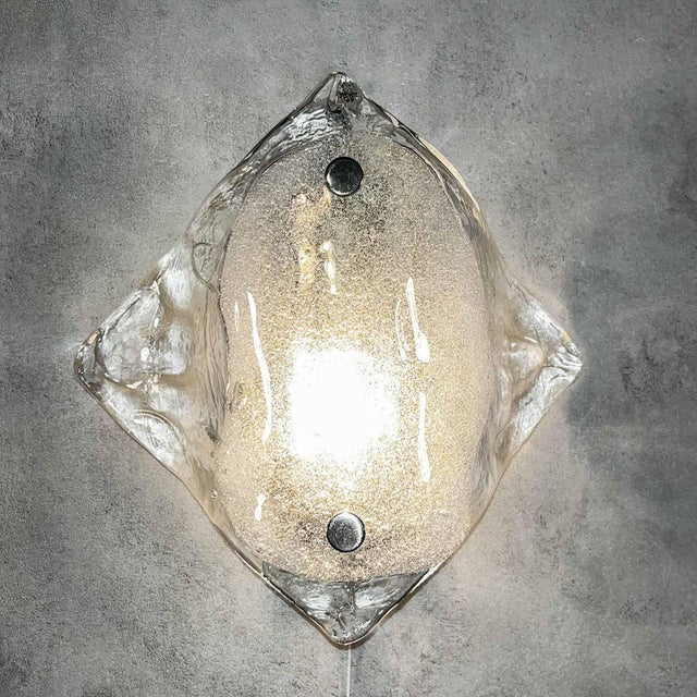 This extremely rare ice glass wall sconce was manufactured by kalmar franken in austria. Kalmar franken is a lighting...
