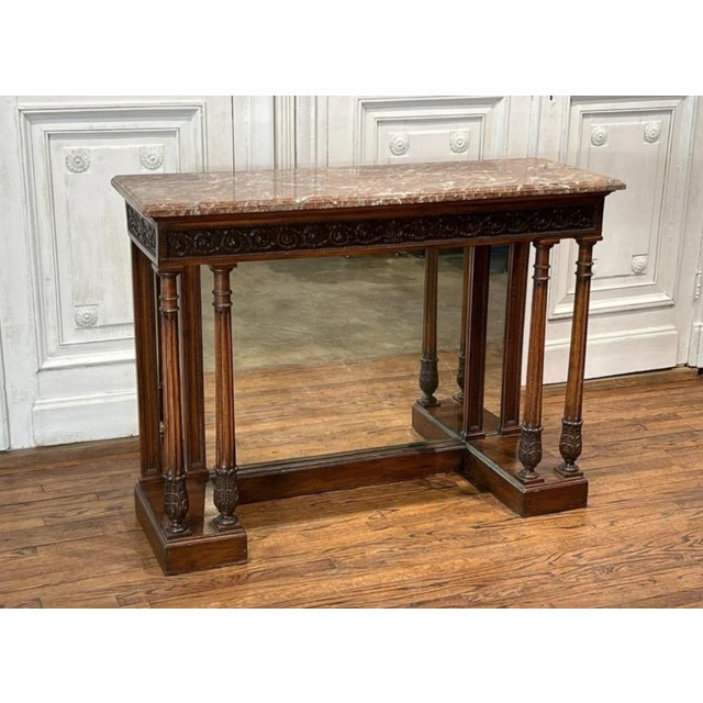 Antique French carved walnut mirrored back console - pier table. France, 19th century, Neoclassical inspired Empire taste,...