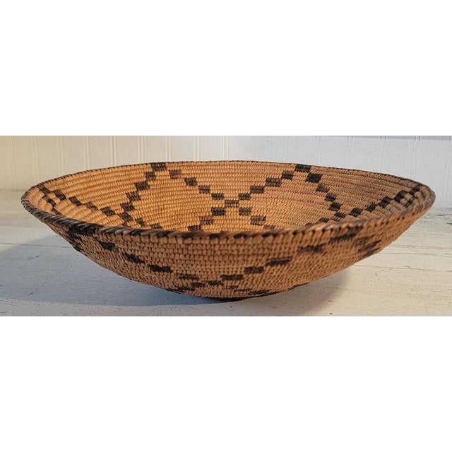 American hand woven and dyed basket made from devils grass and hemp. Wonderful sunflower pattern on both sides of the...