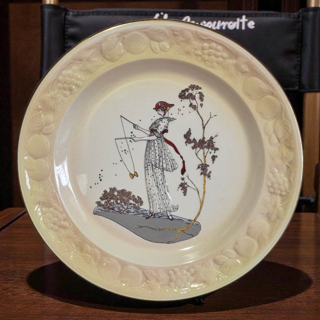 The Vintage Royal Worcester Palissy Majolica Figural "Jane" Plate is a beautiful piece of English porcelain craftsmanship....