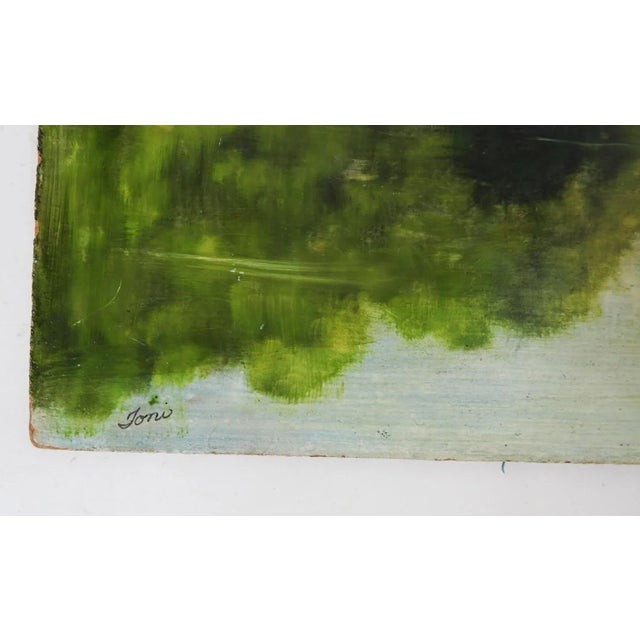 Vintage late 20th century oil on masonite landscape painting of forest reflected in lake. Signed Toni lower left....