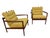 This rare pair of Mid-Century Danish Modern arm chairs was designed by Poul Jensen for Selig and showcases the sculptural...