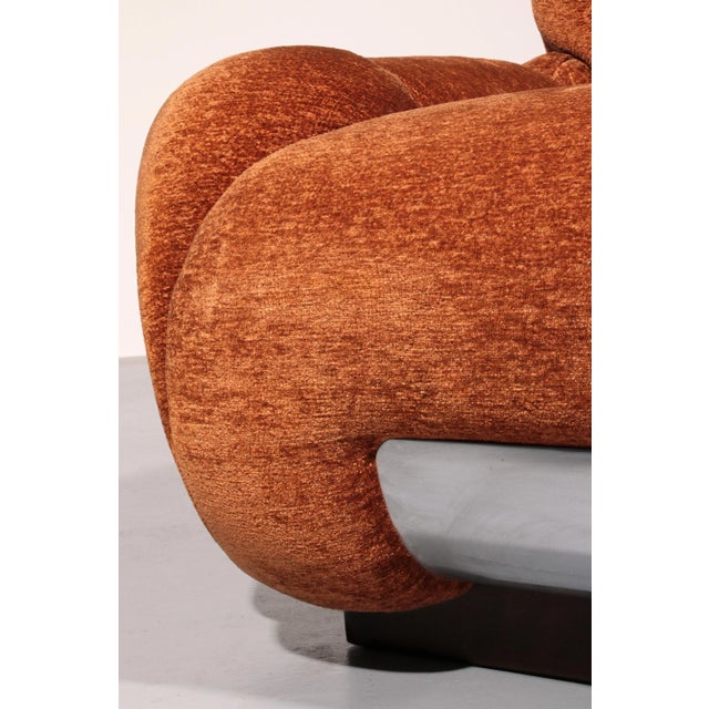 This pair of lounge chairs, designed in the style of Adriano Piazzesi and crafted in Italy during the 1970s, exemplifies...