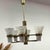 Mid-Century Modern chandelier made in the 1960s. It has six arms, each with glass shade in extraordinary shape. The light...