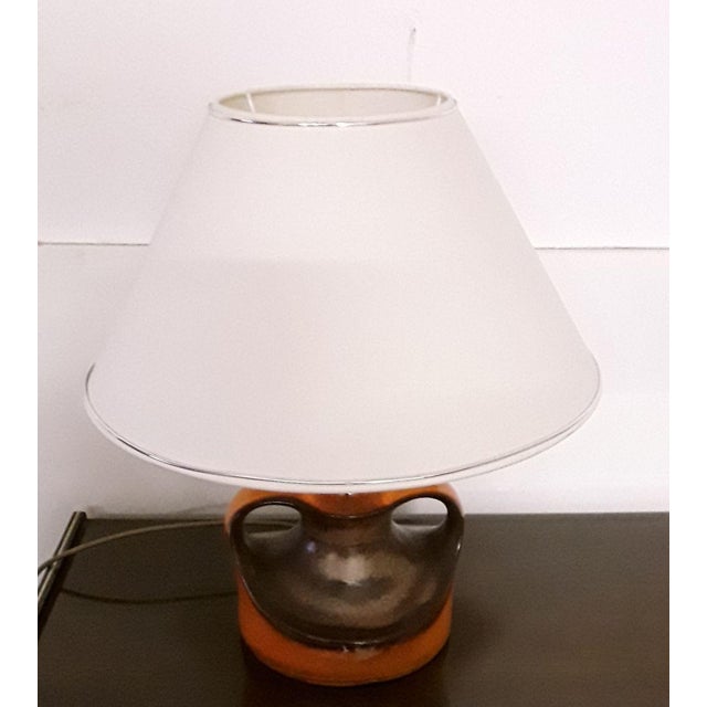Table Lamp With Ceramic Stem In Orange and Brown & Creamy White Shade, 1970s, in Good conditions. Designed 1970 to 1979...