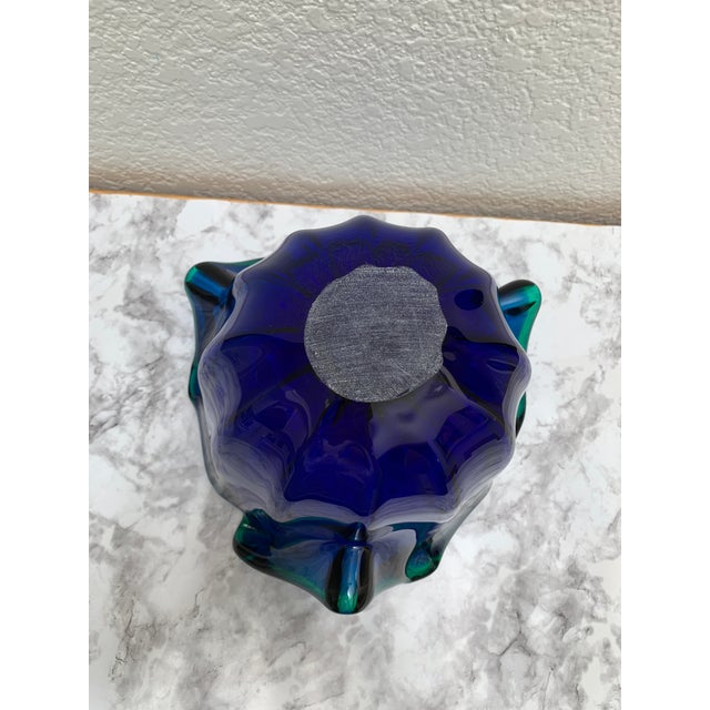 Vintage artisan glass free form cobalt blue decor bowl with wavy water like form and hints of green tones in the light.