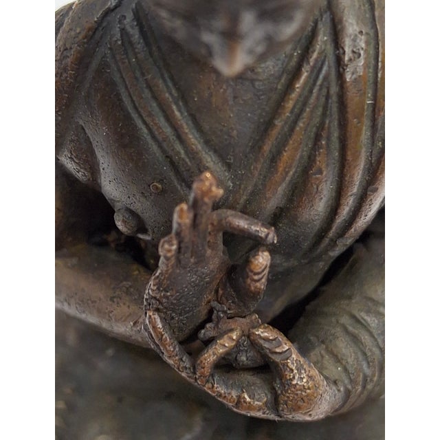 This is a rare and exceptional bronze Tibetan Lama, dating to the late 18th or early 19th century. Unlike generic deity...