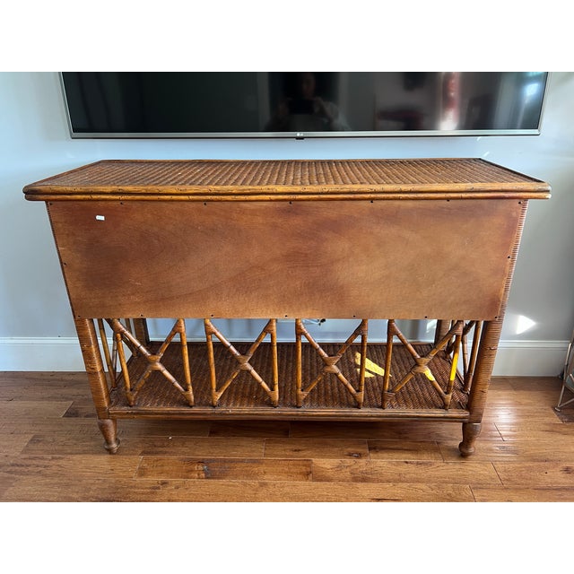 This is a beautiful vintage Tommy Bahama sideboard/credenza/console. It is constructed of woven reed and wood. It was made...