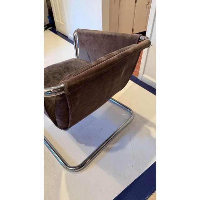 Striking vintage modern chrome cantilever lounge chair with original grey suede/leather upholstery. Sculptural, low-slung,...