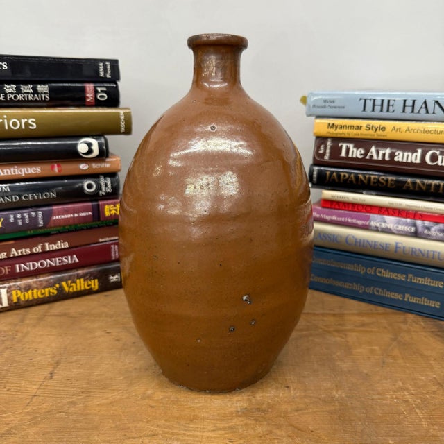 "About This Piece About This Piece This vintage Japanese tokkuri, or sake bottle, carries the quiet beauty of functional...