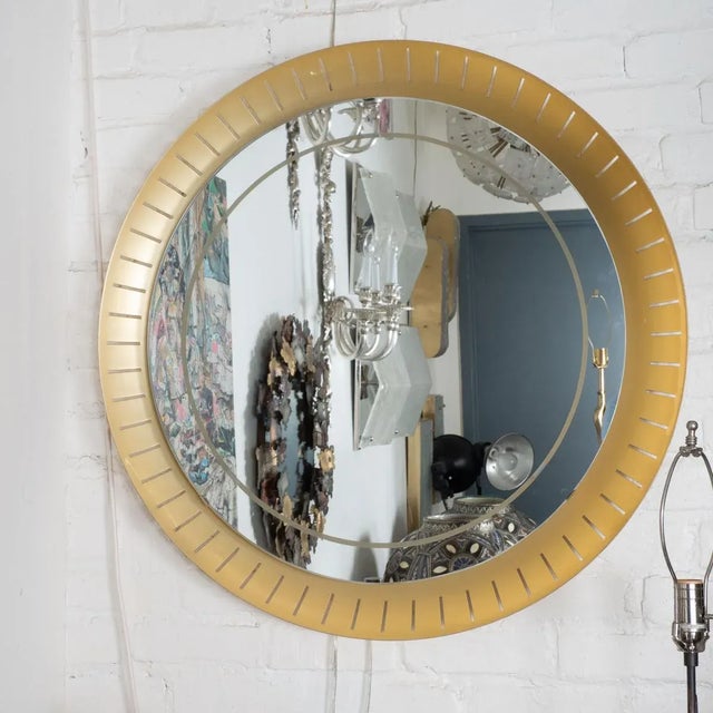 Perforated, concave brass, backlit mirror by Hillebrand in the style of Stilnovo. Newly replaced mirror with frosted trim...