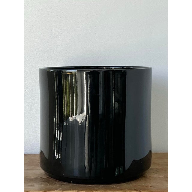 This monumental vintage planter by the esteemed Gainey Ceramics is a masterclass in mid-century architectural design....