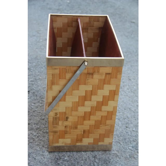 This magazine rack in bamboo and brass is from the 1970s.