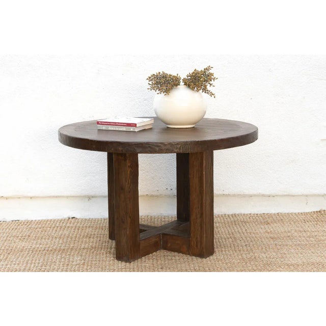 This stunning round dining table is a study in solid form and rustic elegance. Measuring a generous 48 inches in diameter...