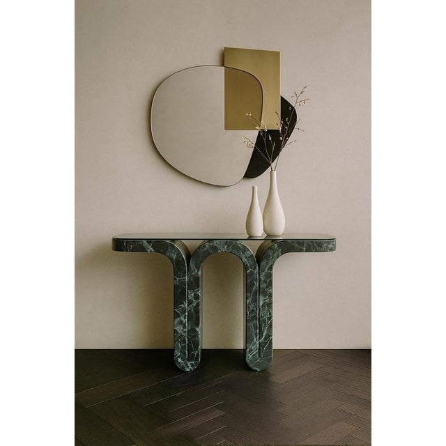 Fold verde alpi console by etamorph dimensions: w 120 x d 35 x h 80 cm. Materials: verde alpi and tinted artistic glass....