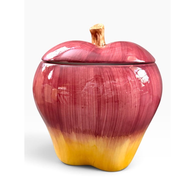Vintage ceramic apple-shaped cookie jar by Asia Master Group Incorporated. Features a glossy red and yellow apple finish...