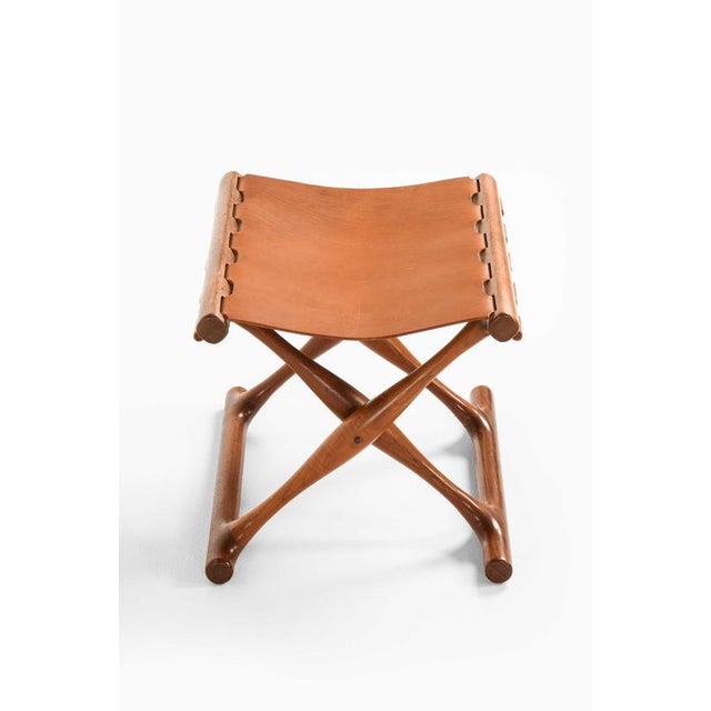 This rare folding stool, model guldhøj or ph 43, was designed and produced by poul hundevad in vamdrup, denmark, and...