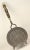 An impressive antique fireplace tool Large round griddle made from wrought iron with wooden handle, fastened and adorned...