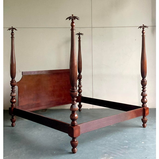 Step into a realm of timeless elegance with this vintage Hollywood Regency carved rice poster king size bed. This...