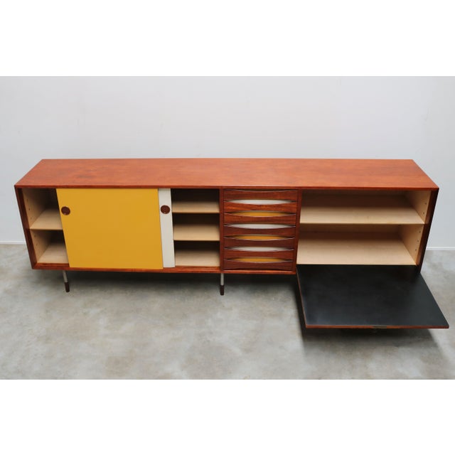 An exceptional and highly collectible model 29a “triennale” sideboard, designed by renowned danish designer arne vodder...