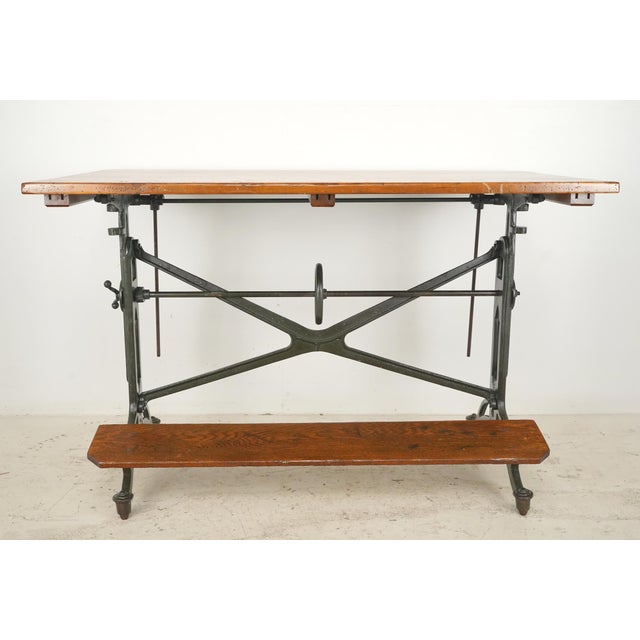 This appears to be a reproduction of the "American Eagle" Table made by Keuffel & Esser c. 1900-1920. This drafting table...