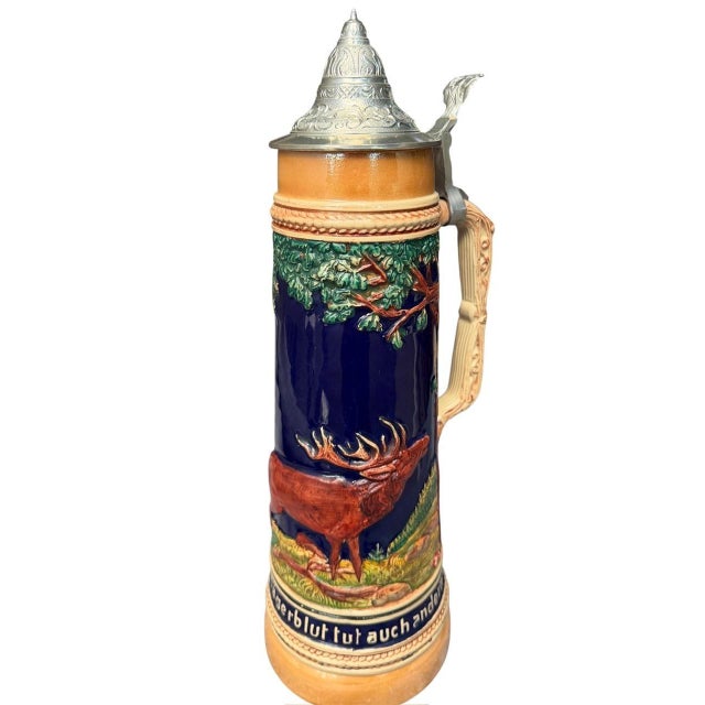 Large 2-liter German stein with embossed stag, deer, and tree scenes — beautiful scenes and color, conical metal lid....