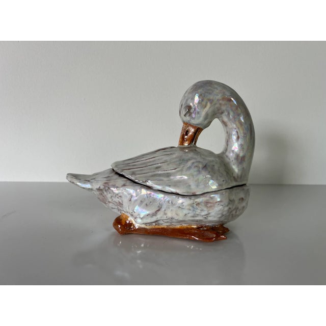Offered for sale this vintage art hand made terracotta glazed decorative swan sculpture . Signature stamped on metal by...