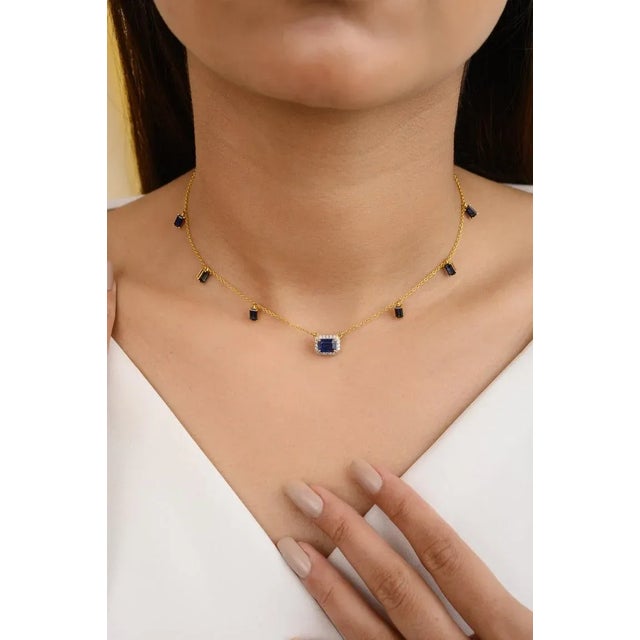 Dangling Blue Sapphire Diamond Chain Necklace in 14K Gold studded with baguette cut blue sapphire and round cut diamonds....
