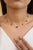 Dangling Blue Sapphire Diamond Chain Necklace in 14K Gold studded with baguette cut blue sapphire and round cut diamonds....